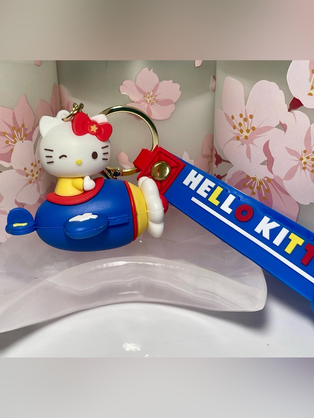 Hello Kitty Blue and Red Airplane Keyring with Yellow Accents